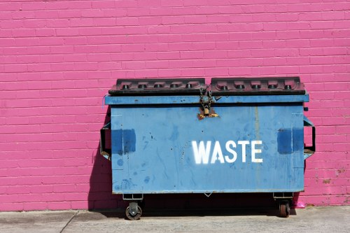 Crew inspecting commercial recycling bins in an Edmonton business district
