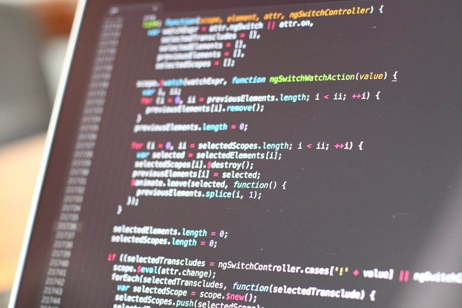 A computer screen displaying a close-up view of code in a text editor. The code consists of lines of text with various colors, including red, green, purple, and blue, indicating syntax highlighting fo